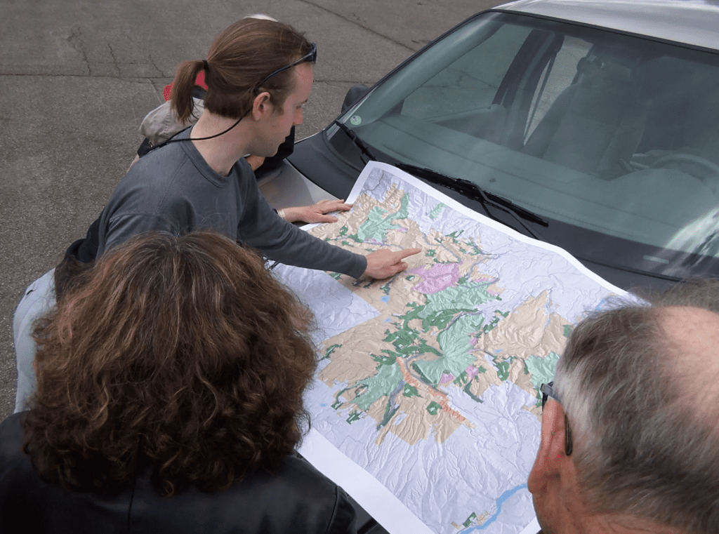 Oregon Wild staff Erik Fernandez looking at a map
